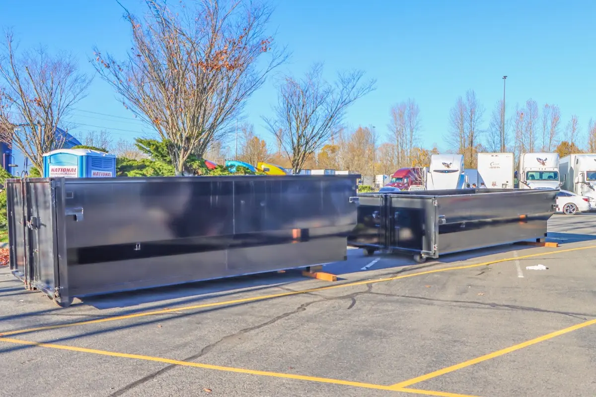 Professional dumpster rental service with roll-off container on residential driveway in St. Helena